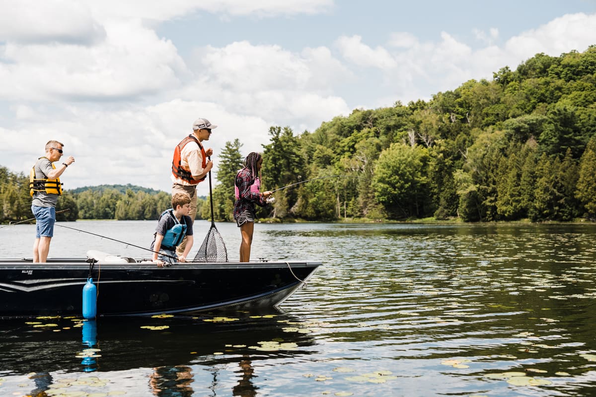 A fishing adventure in Petite Nation - Two adults and two children fishing on a small boat