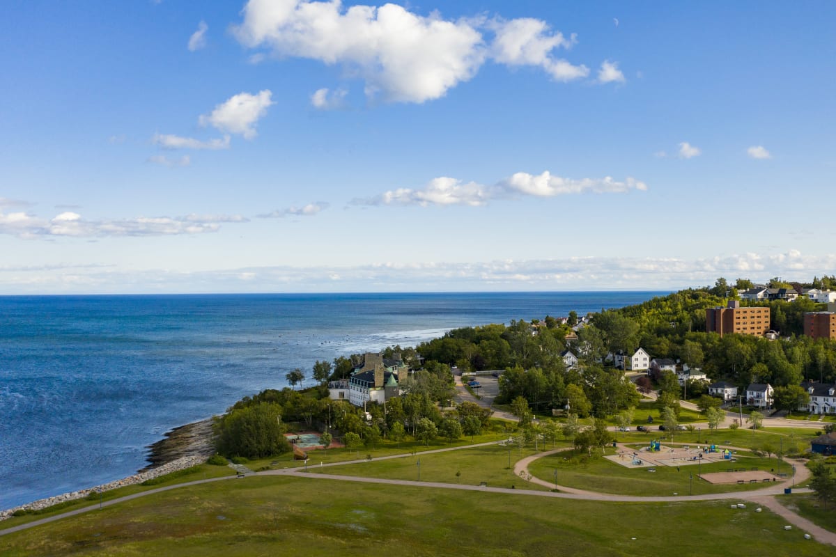 Aerial view of Baie-Comeau in the summer by the river. 