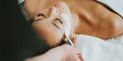 Woman receiving a facial treatment