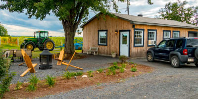 Domaine Berthiaume - A wooden building in the countryside.