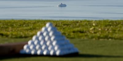 Golf ball in front of the river