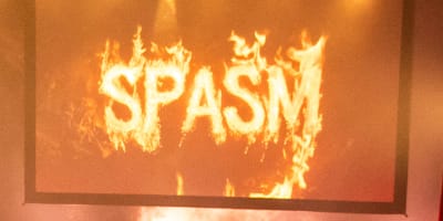 SPASM Festival -  Dark venue filled with spectators.