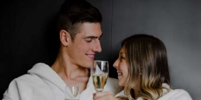 Couple holding glasses of sparkling wine