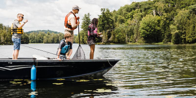 A fishing adventure in Petite Nation - Two adults and two children fishing on a small boat