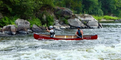 Canoe in river.
