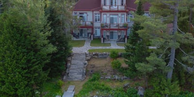 Aerial view of the inn and the lake on a summer evening.