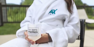 Woman in a bathrobe at Ax Hôtel Mont-Tremblant.