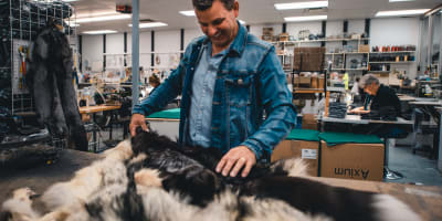 Bilodeau Canada - A man handling fur in a workshop
