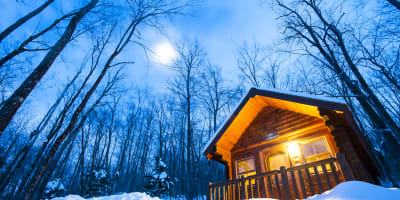 An illuminated cabin at Sommet Morin Heights.
