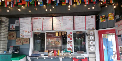 Menu and counter at Casse-croûte Le Gourmand.