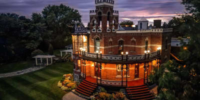 Château Saint-Antoine illuminated at night.