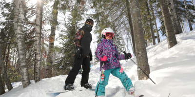 Children skiing and snowboarding at Tobo Ski.