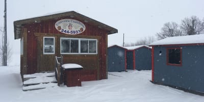 Fishing hut on a frozen lake.