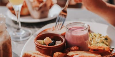 Brunch plate and orange juice glass.