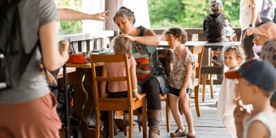 Festi-Enfant au Moulin - A woman applying face paint to a child