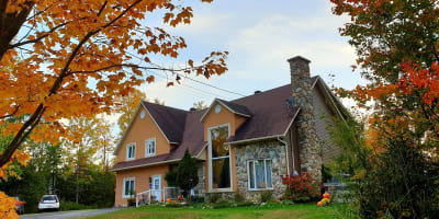 Exterior of the Gîte L'Antre d'Eux in autumn.