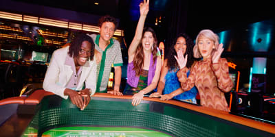 A group of friends having fun at the casino.