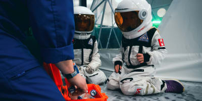 2 children dressed as astronauts.