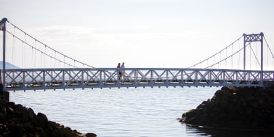 Couple on a bridge.