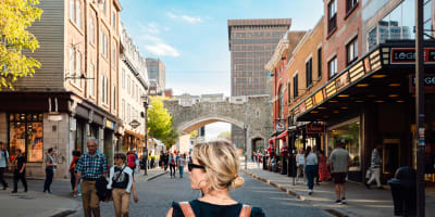 A woman seen from behind, walking in Quebec City.