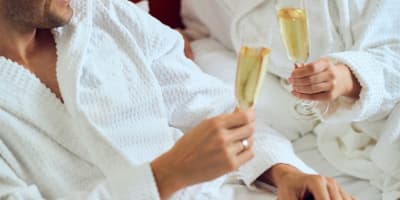 A couple with sparkling wine - Hotel Sepia.