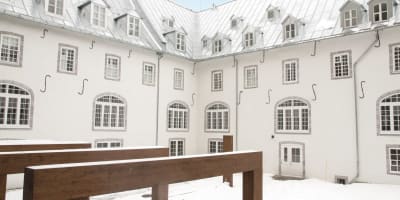 Exterior of the Monastère des Augustines in winter.