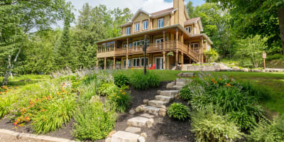 Exterior of Les Dames du Lac B&B in summer.