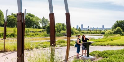 Cartier-Brébeuf National Historic Site - Two adults in a park