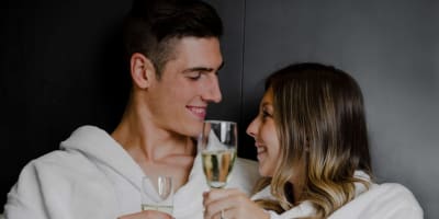 Couple holding glasses of sparkling wine