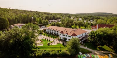 Aerial view of Manoir du Lac William in summer.