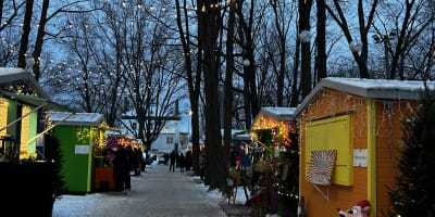 The Old Saint-Eustache Christmas Market lit up in the evening.