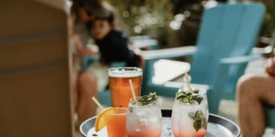 Le Roquemont - A tray of drinks on an outdoor table