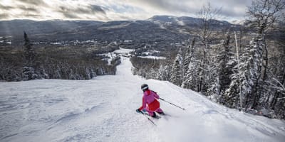 skier going down a ski slope