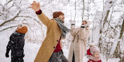 A family is having fun on a snowy day.