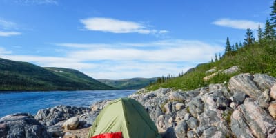 Wild camping by a river.