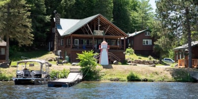 Waterfront and main cottage in the summer.