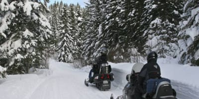Snowmobiling at Michel St-Louis Outfitters in winter.