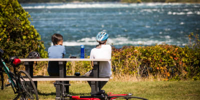 Two people and their bikes at RécréoParc.