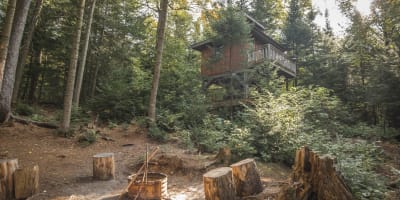 Perched cabin and campfire.