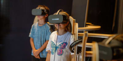 Two children and virtual reality at Statera—the fabulous archipelago.