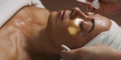 A woman receives a facial treatment at the Strøm Spa Nordique