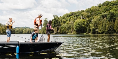 A fishing adventure in Petite Nation - Two adults and two children fishing on a small boat