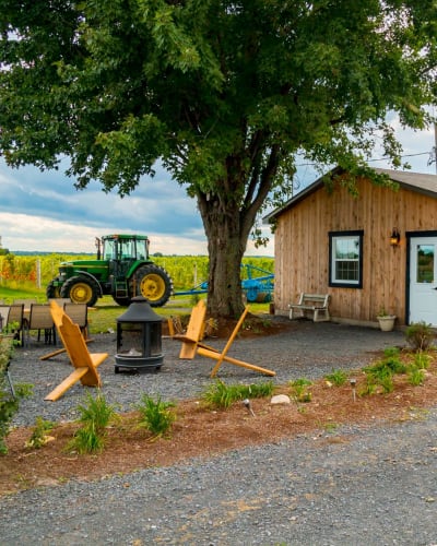 Domaine Berthiaume - A wooden building in the countryside.