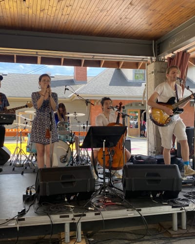 Sherbrooke en musique - Music band performing on an outdoor stage.