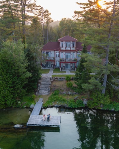 Aerial view of the inn and the lake on a summer evening.