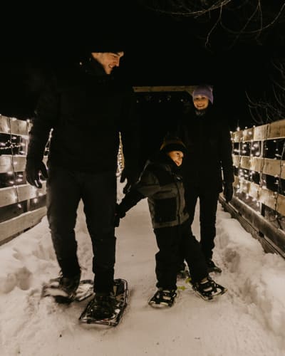Family on a snowshoe hike.