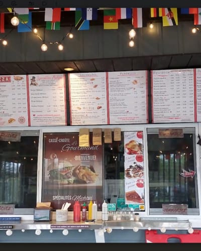 Menu and counter at Casse-croûte Le Gourmand.