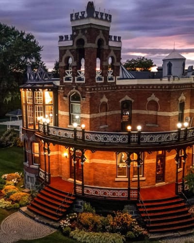 Château Saint-Antoine illuminated at night.