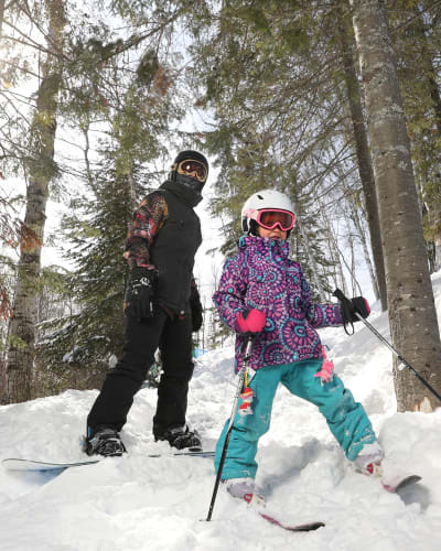 Children skiing and snowboarding at Tobo Ski.