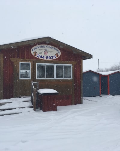 Fishing hut on a frozen lake.